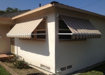 Tan and brown smaller awnings covering windows